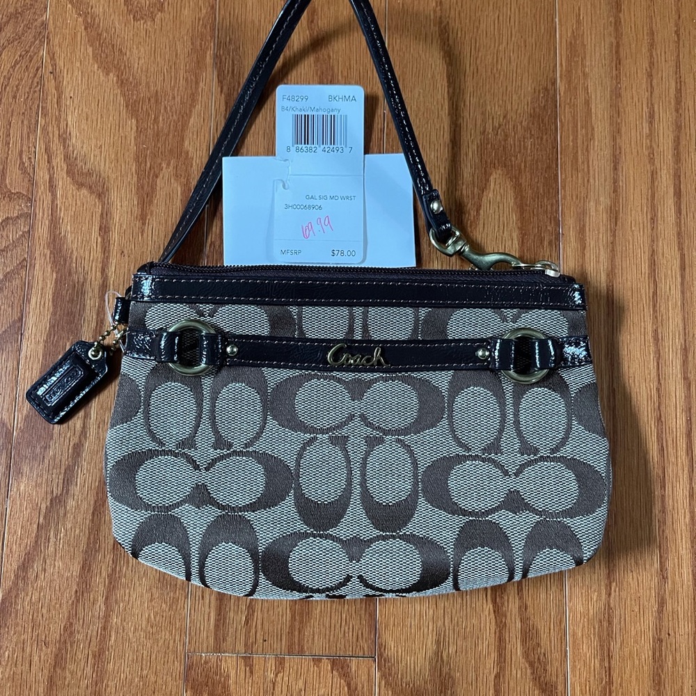 Coach signature canvas wristlet.
